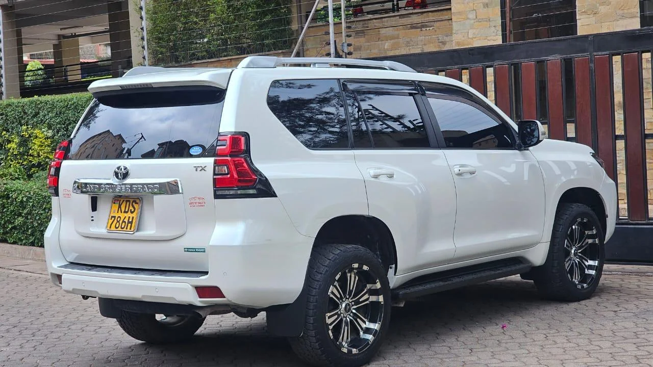 Side view of the White Toyota Landcruiser Prado